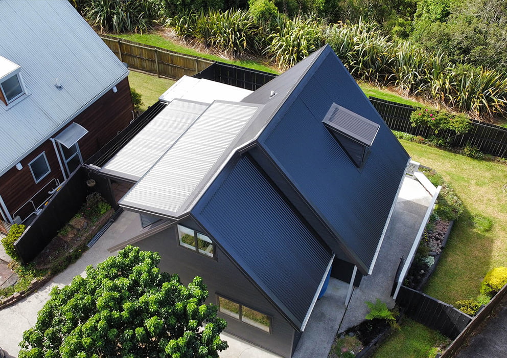 A sloped new long run roof on an existing home.