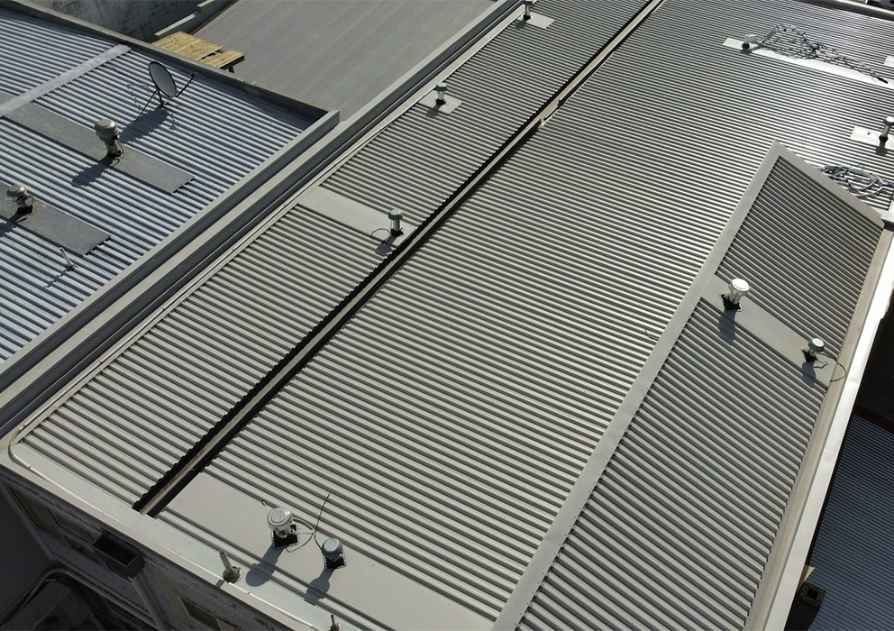 Photograph of a new coloursteel roof on a commercial building.