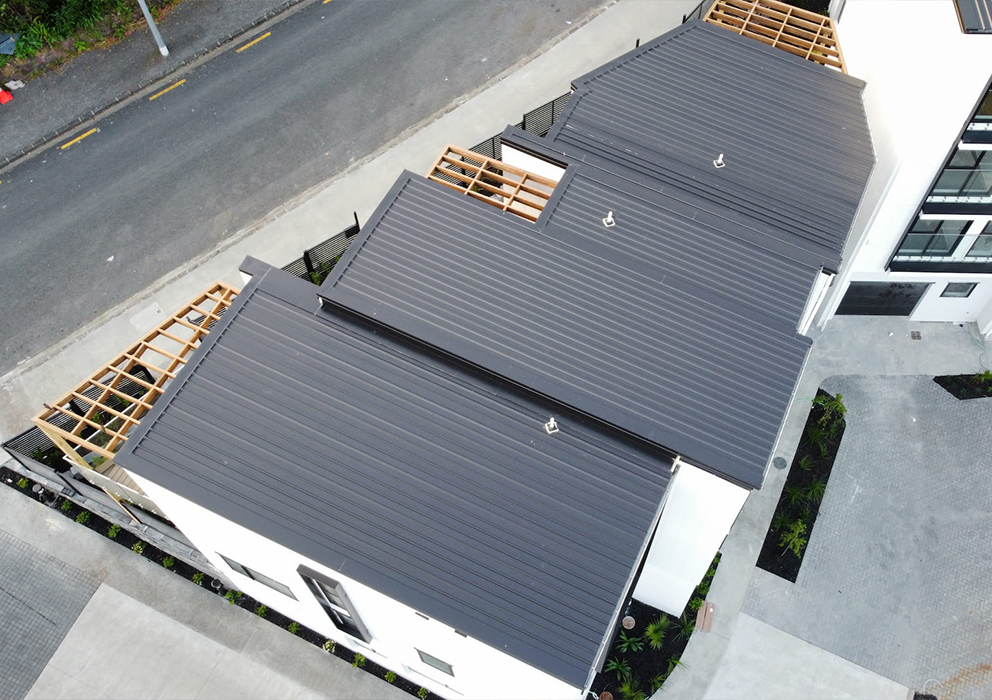 Photograph of coloursteel roofing on a new appartment block.