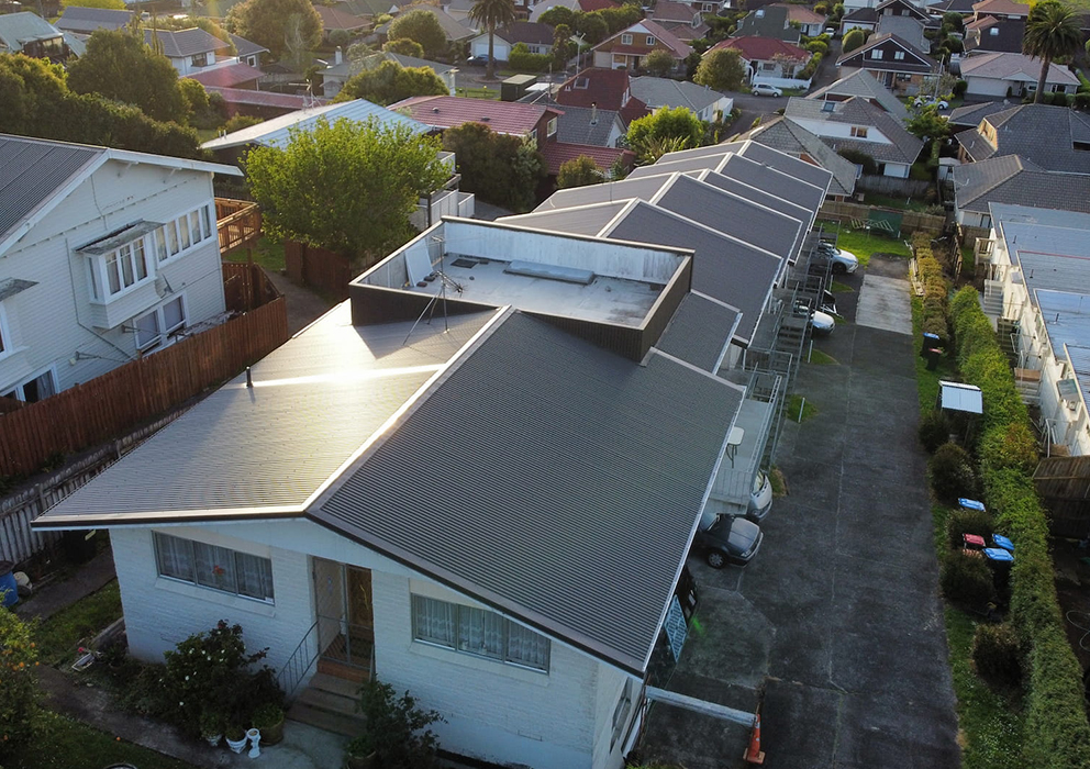 Aerial photograph of new coloursteel roofing on residential units.