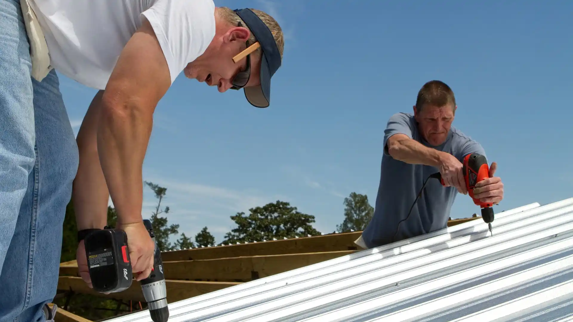 two men installing a new roof